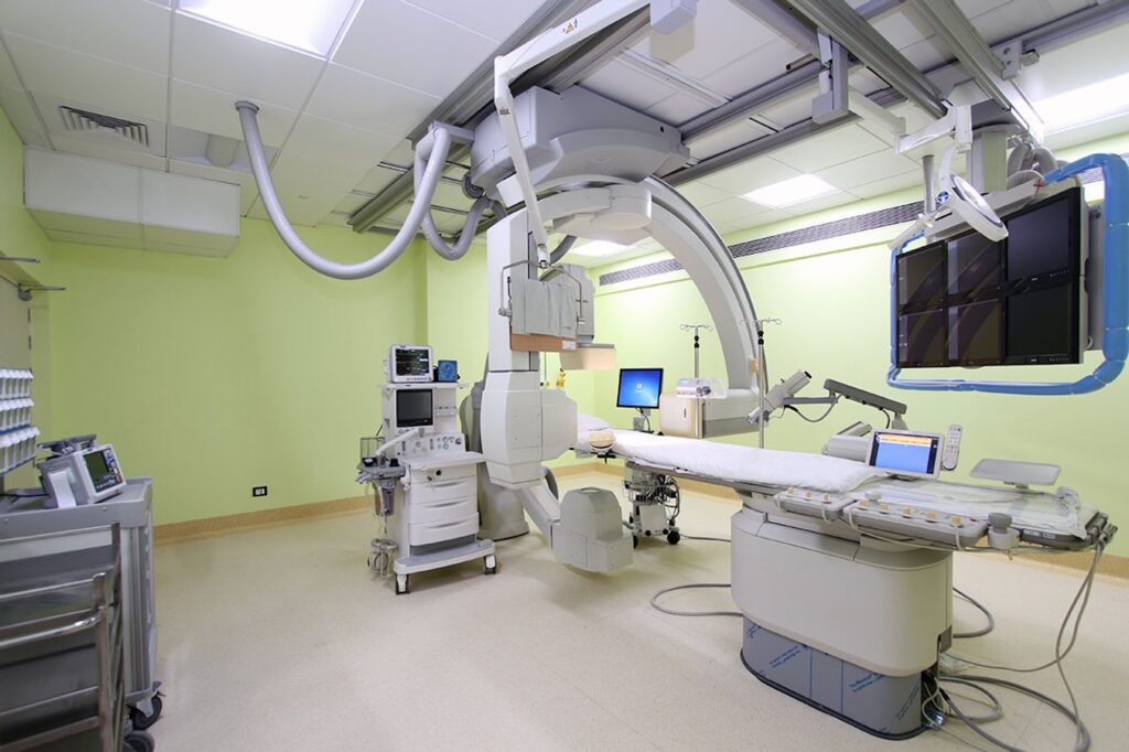 Best pediatric cardiologist in Mumbai- Dr Supratim Sen. Senior Interventional Pediatric Cardiologist Dr Supratim Sen doing a complex cardiac intervention in the biplane cardiac cathlab